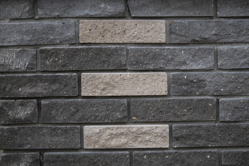 the texture of the gray tiles on the wall