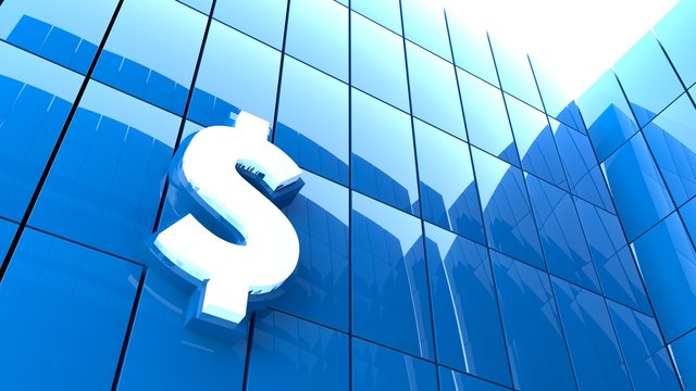 Dollarzeichen auf Hochhausfassade