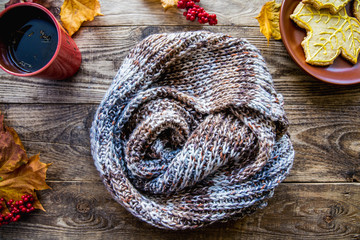 scarf and autumn leaves and red tea mug