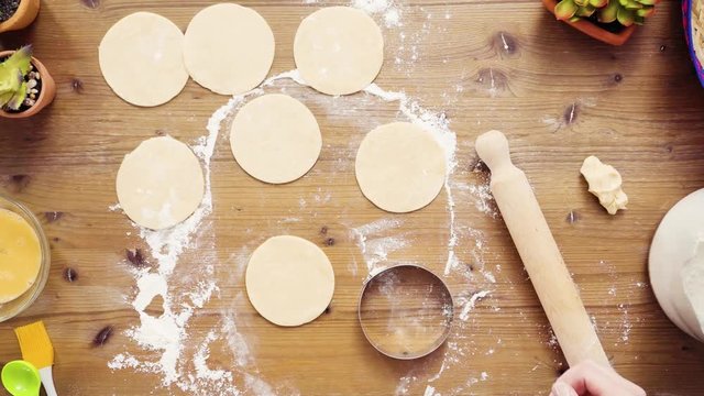Time lapse. Flat lay. Step by step. Rolling dough for home made empanadas