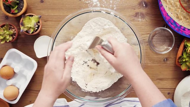 Time lapse. Flat lay. Step by step. Mixing ingredients to make dough for empanadas