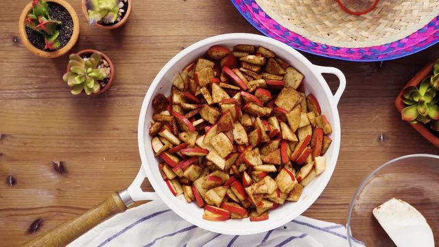 Flat lay. Step by step. Frying red apples with brown sugar for filling to make empanadas