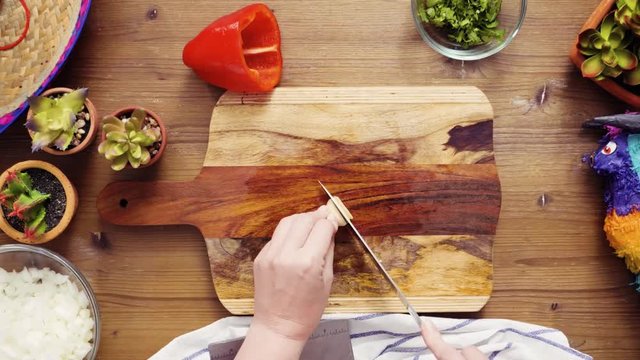 Time lapse. Flat lay. Step by step. Slicing garlic for filling to make empanadas