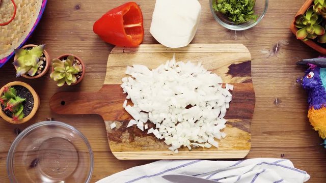 Flat lay. Step by step. Slicing vegetables for filling to make empanadas
