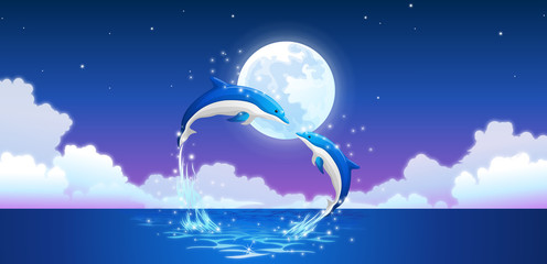 Two bottle-nosed dolphins jumping out of water © zzve