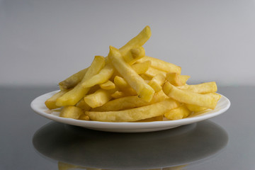 Potato fry or fries on dark background