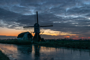 Windmill Along Frozen Canal