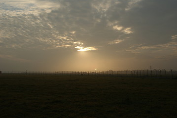 Sunrise in Bremen city in summer on the airport landing road and beautifyl sky clouds