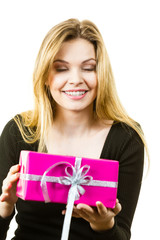 Happy surprised woman with many gifts