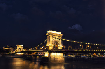 Gorgeously lit chain bridge in Budapest at twilight