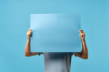woman holding empty white board