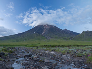 cloud cap over a volcano Ovalnaya Zimina, Kamchatka Peninsula, Russia.