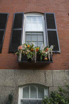 Shutter window with bouquet of flowers