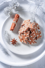 Fototapeta na wymiar Sweet gingerbread cookies for Christmas on white plate