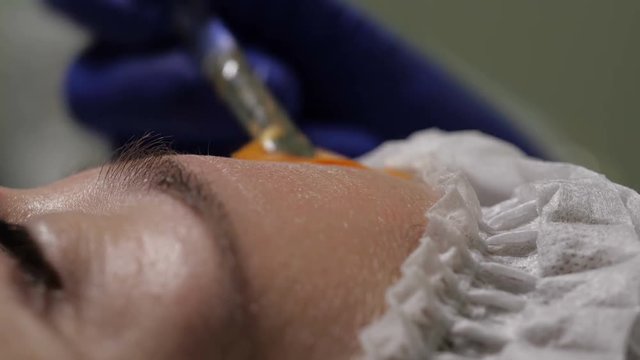 close up of applying moisturizing face mask