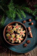Sweet cookies in the shape of man with pinecone