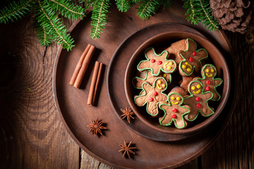 Fototapeta na wymiar Homemade cookies in the shape of man on rustic tray