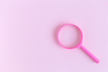 Magnifier on pastel background search minimalistic concept. Space for copy.