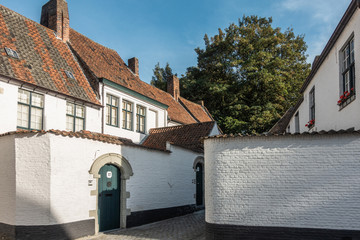 Kortrijk, Flanders, Belgium - September 17, 2018: Corner view of the beguinage with white and red...