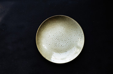 Ceramic plate on dark background