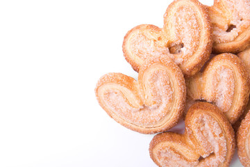 Homemade cookies on the right side of the frame isolated on white background