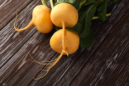 Yellow Turnip On Wooden Background.