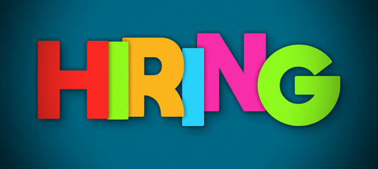 Hiring - overlapping multicolor letters written on blue background