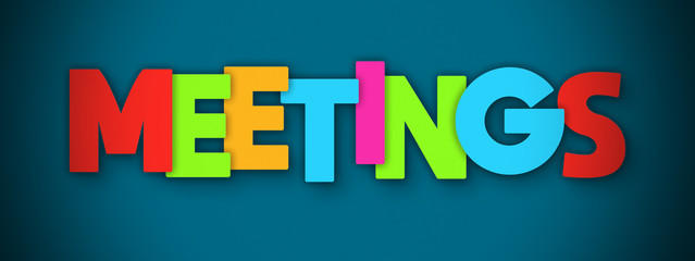 Meetings - overlapping multicolor letters written on blue background