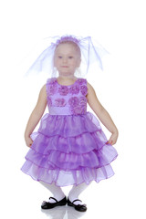 Little girl in purple dress.