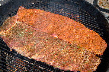 Seasoned Ribs Cooking on the Grill