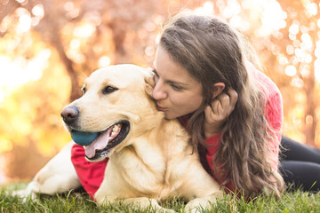 Young smiling woman with her cute dog 