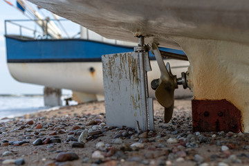 The propeller of the sea fishing boat. Sea boats on the port wharf.