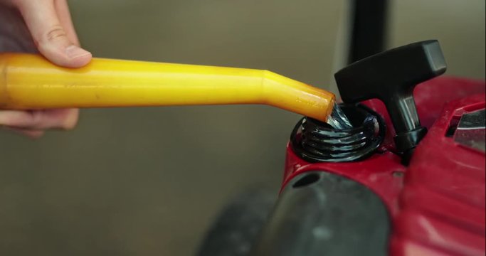 Gas Tank of Gas-Powered Machine Filled Up in Closeup Shot