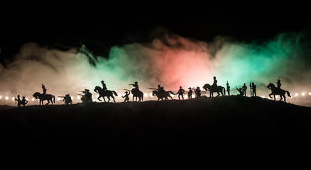 Naklejka na ściany i meble American Civil War Concept. Military silhouettes fighting scene on war fog sky background. Attack scene.