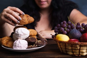 Sugar addiction, nutrition choices, conscious eating, overeating. Cropped portrait of overweight...