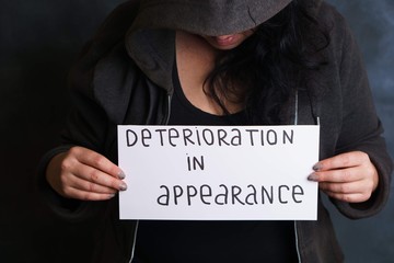 Inconvenience, overweight, shy, body shaming, weight loss. Unrecognizable woman hiding face worried...