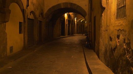 In focus background plate of empty Italian street at night to be composited