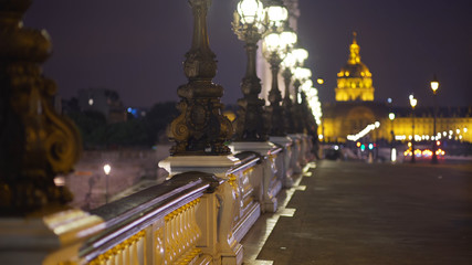 Fototapeta na wymiar Out of focus view of Les Invalides across the Pont Alexandre III bridge in Paris