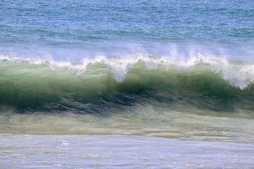 Large empty wave crashing in the ocean 