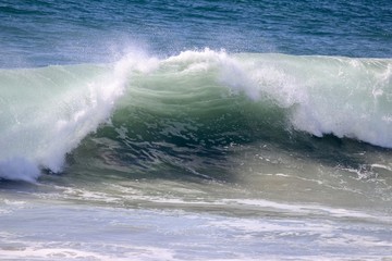 Large empty wave crashing in the ocean 