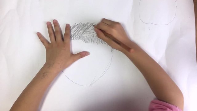 Child draws a picture