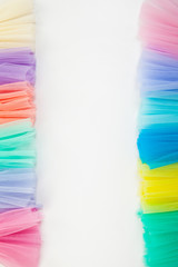 Colorful fabric rolls in warehouse - isolated on white background