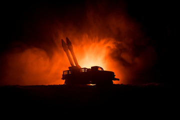 Rocket launch with fire clouds. Battle scene with rocket Missiles with Warhead Aimed at Gloomy Sky at night. Rocket vehicle on War Backgound