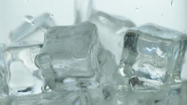 Pouring soda water with ice and bubbles in the glass
