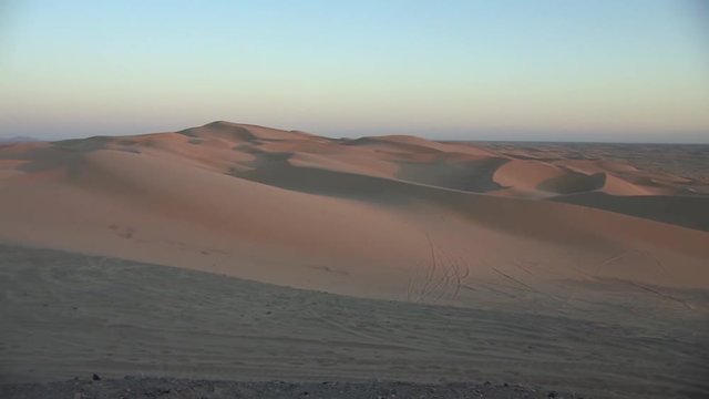 Pan shot of North Algodones Dunes in California in evening sun, USA.