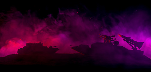 Fototapeta na wymiar Sea battle scene. Silhouette of military war ship on dark foggy toned sky background. Explosion and fire. Dramatic scene decoration.
