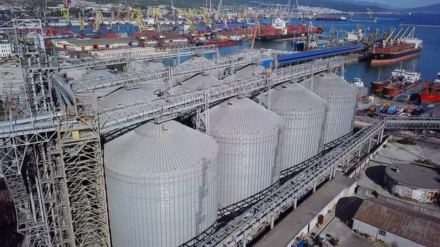 View from Above of the Grain Terminal in the Commercial Sea Port.In the Background you can see the Container Yard and Ships under Loading