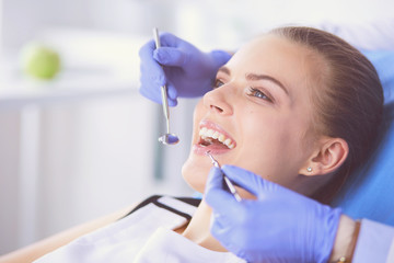 Young Female patient with open mouth examining dental inspection at dentist office. - 226130818