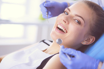Young Female patient with open mouth examining dental inspection at dentist office. - 226130858