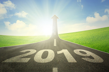 Road with numbers 2018 and upward arrow